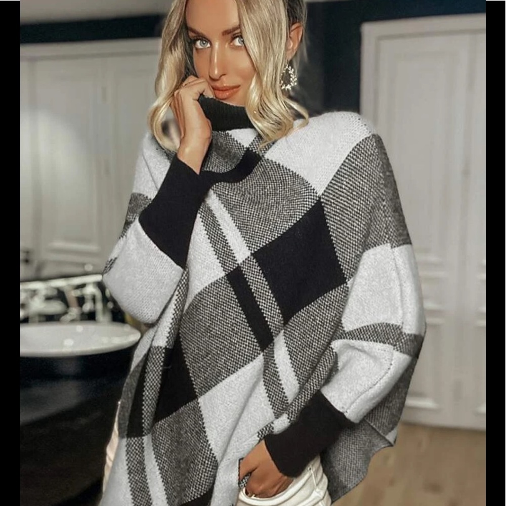Assymetrical sweater poncho black and white. One size fits all.